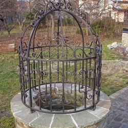 A wrought iron dome for a well