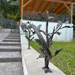 Stylish hand-forged railing and fencing with a forest motif