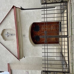 Wrought iron gate with a cross made for a church