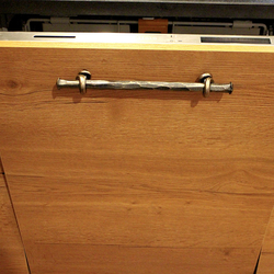 Forged handles on the door of the integrated dishwasher