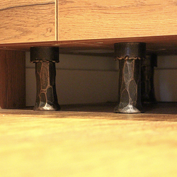 Forged furniture feet - kitchen cabinet in a family house