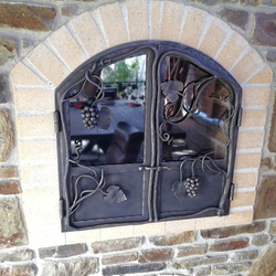 Hand-forged garden fireplace doors with grape motif