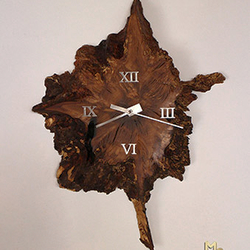Thousand year-old Oak Tree Clock - a luxury oak tree trunk clock complemented by modern stainless steel elements