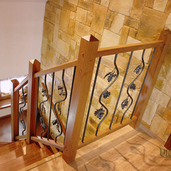 A wrought iron railing with the motif of oak