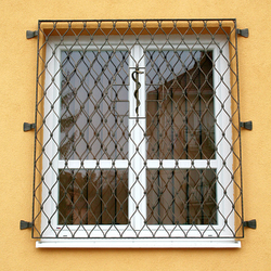 Wrought-iron grilles Waves on the window with a snake in the middle – Levoča pharmacy