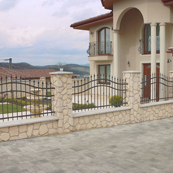 A forged fence of a ground and balcony railings 