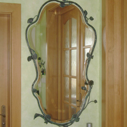 A hand wrought iron mirror - luxury furniture