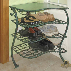 A wrought iron shoe-rack - artistic furniture