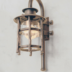 A wrought iron wall light Granny - exterior lamps