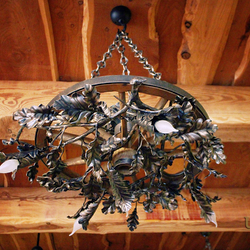 A hand wrought iron light - a wrought iron chandelier Pine