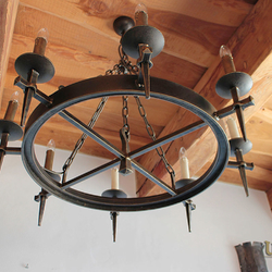 Luxurious wrought iron ceiling lighting with historical design recalls old times