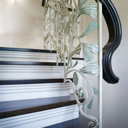 Wrought iron staircase railing in a historic style - a family house
