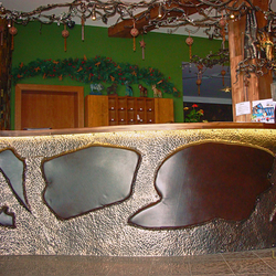 A forged reception desk with wrought iron sheets and high-quality beef leather