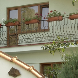 Forged balcony railing with flower pot holders