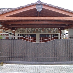 A wrought iron gate - metal plate and wrought iron combination