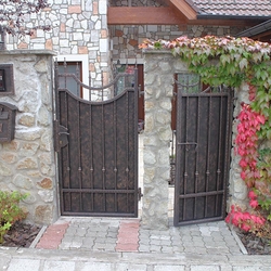 A wrought iron fence - metal plate and wrought iron combination