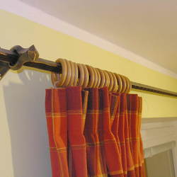 A wrought iron curtain rod - wrought iron furniture