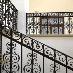 A wrought iron railing of the 15th-century building