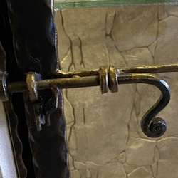 Forged latch on a showcase in a historic building