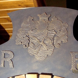 A family coat of arms on the fireplace