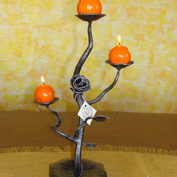 A wrought iron candleholder -a Romantic
