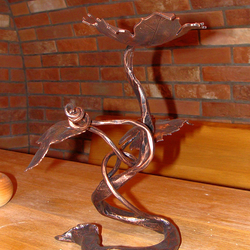 A wrought iron candleholder - a vine