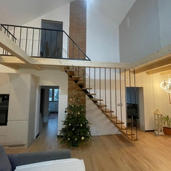 Modern metal railing on the stairs of a family house - interior railing