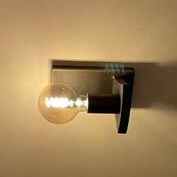 A designer wall mounted lamp was created by the connection of modern and traditional