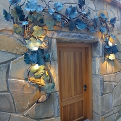 Design wall lamp Grape at the entrance to the wine cellar - exclusive lighting