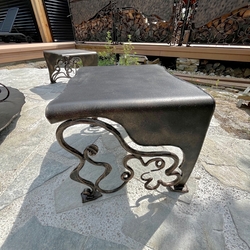 Hand-forged garden chair for a multifunctional fireplace with grill